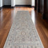 7' X 10' Silver Taupe and Blue Oriental Power Loom Worn Faded Area Rug With Fringe